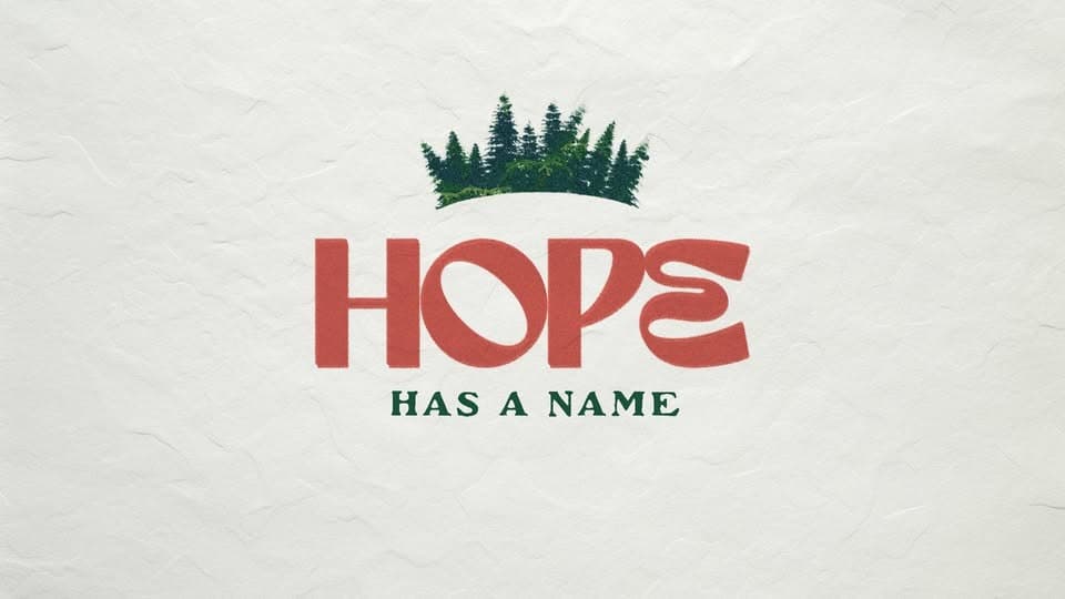 Text graphic featuring the word "HOPE" in bold red letters, with "HAS A NAME" in green underneath and a green forest crown above.