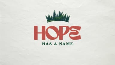 poster grove of christmas style trees at the tope then the word in large red letters HOPE-under that in smaller green letters -Has a Name