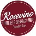 Log in maroon round wit wording Rosevine Inn Bed and Breakfast and Extended Stay lodging