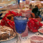 dining table set for breakfast coffe cups, cofee cake and Blue water glass