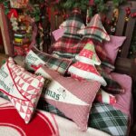 various size and shapes, some Christmas tree shaped, most are quilted all have red, shite and green colors 