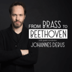 black square with image of Johannes Debus in black with arms crossed words say From Brass to Beethoven