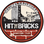 logo round brick red with Tyler downdown skyline in black and beige wording around curve at top says Second Saturday in white in the lower half it says Hit the Bricks in white lettering the under that says Downtown Tyler
