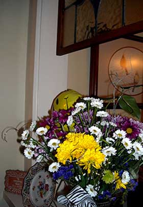 Cheery yellow and purple flowers brighten a nook in the Inn’s public area