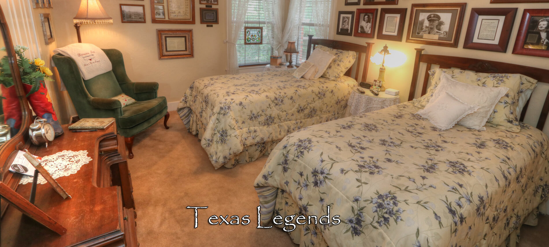 Texas Legends Room with two twin brass beds covered in yellow and blue spreads with nightstand and brass lamps