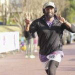 man running on brick street