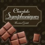 wording Choclats Symphoniques in script and underlined undwer that are the words Maxime Goulet. This is all in a 8 sided box-there are pieces of choclate on the sign also 