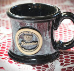 Black coffee cup with Rosevine Inn logo