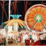 scene at a fair includes bright lights and fair rides 