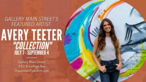 poster advertising Avery Teeter art at Main Street Gallery, downtown Tyler. Background of poster is brown and the artist is standing in front of her art.