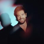 Head shot picture of Jason Crabb he has brown hair, afull short brown beard, nice smile and a dark shirt on