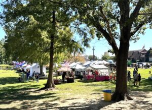 park setting with vendor tents