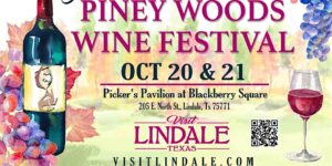poster announcing The Piney Woods Wine Festival Oct. 20 and 21 in lindale there is a wine bottle and full wingalss also grapes