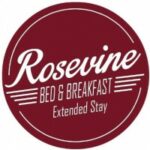 Logo burgandy round says Rosevine Bed and Breakfast Extended Stay