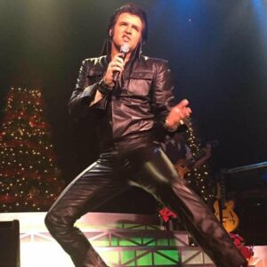 Travis Powell-Elvis Tribute artist-in Black leather