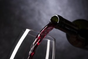 Red wind being poured in a glass